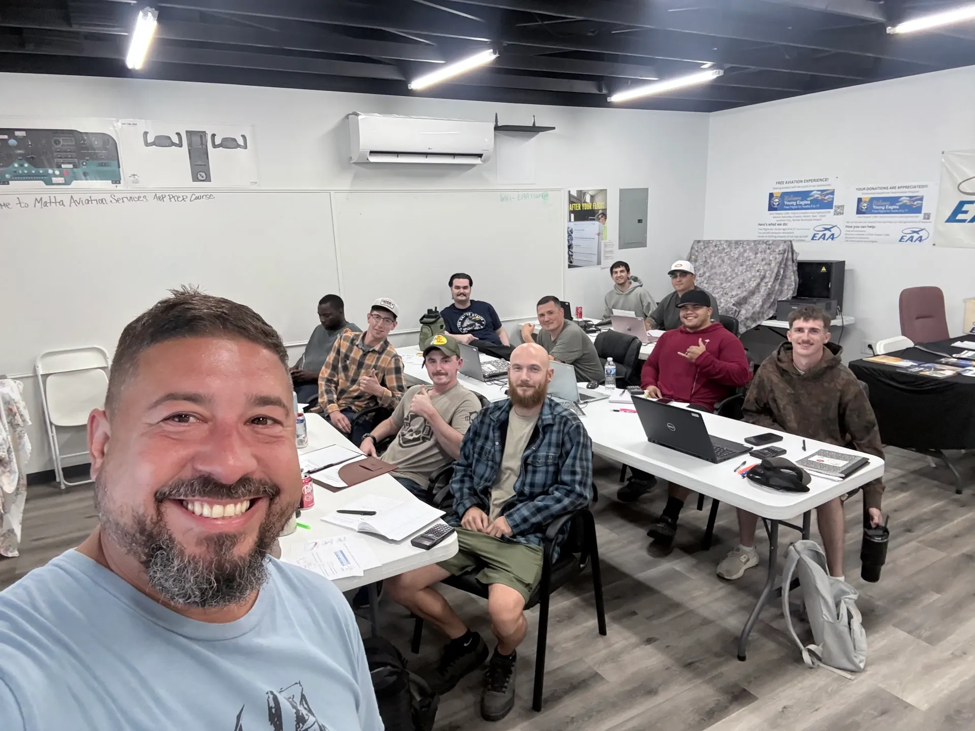 Instructor and A&P prep students gathered in a Matta Aviation Services classroom